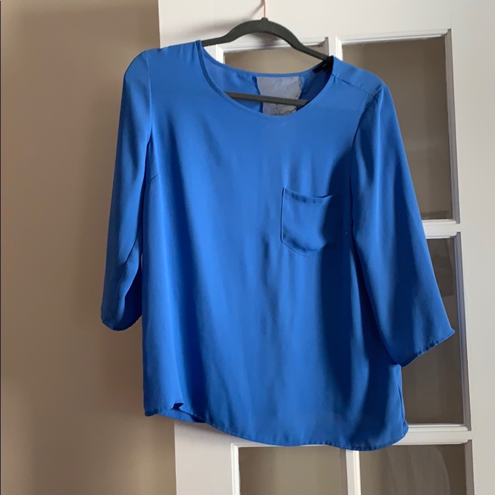 Pretty blue blouse with lace detail back.